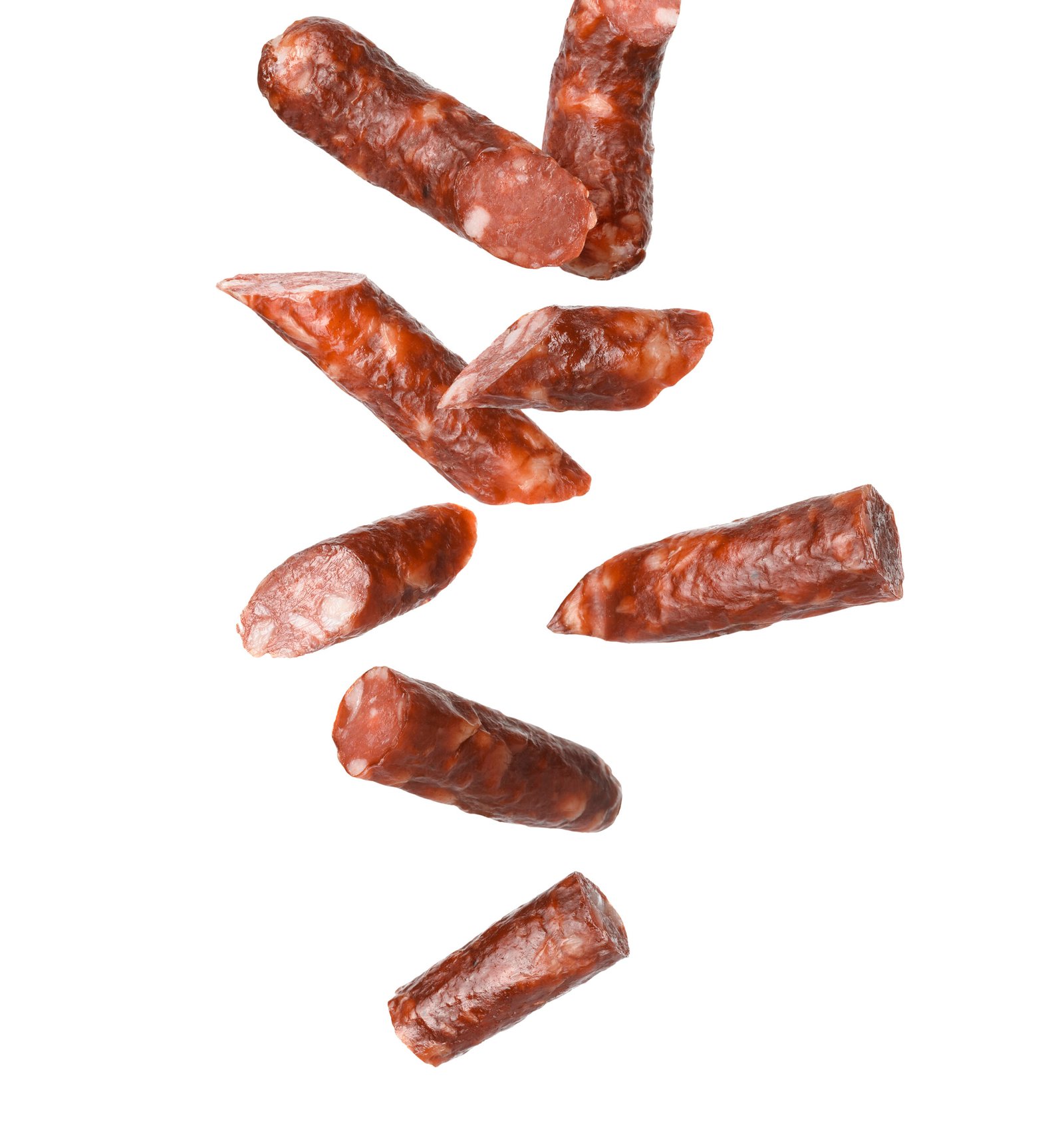 Dry smoked sausage pieces in air on white background, collage